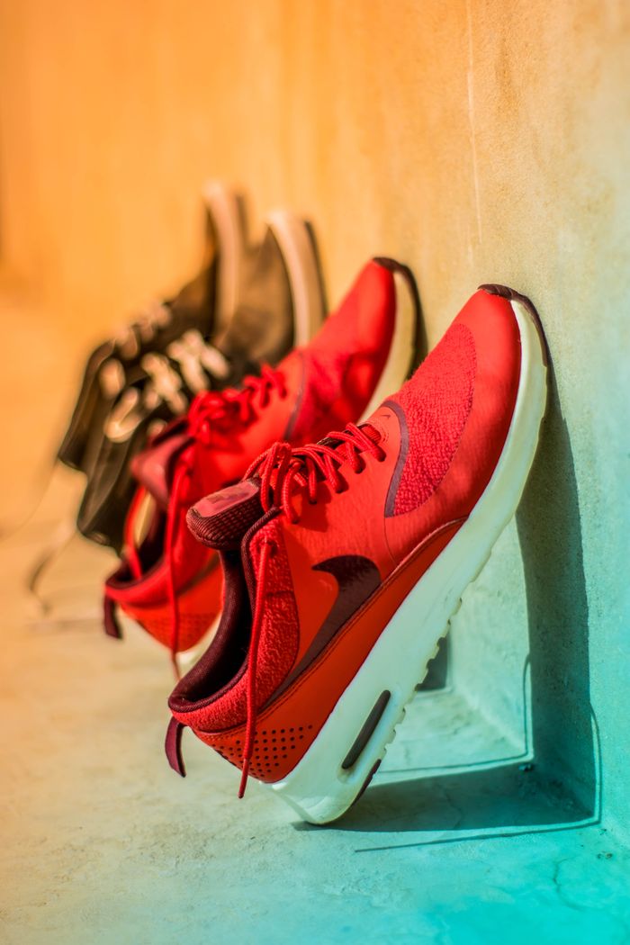 services-03 Vibrant red sneakers on display, showcasing modern footwear style.